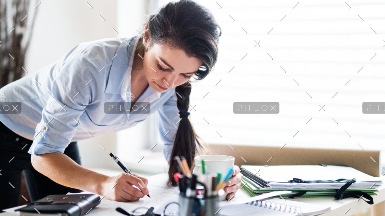 demo-attachment-172-a-portrait-of-a-woman-working-at-home-PW6FL9X