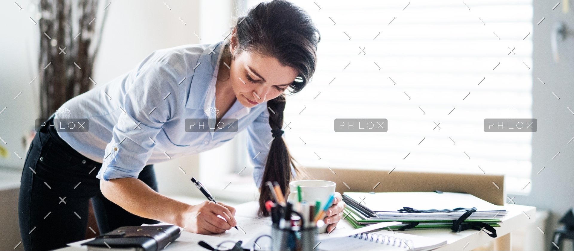 demo-attachment-172-a-portrait-of-a-woman-working-at-home-PW6FL9X